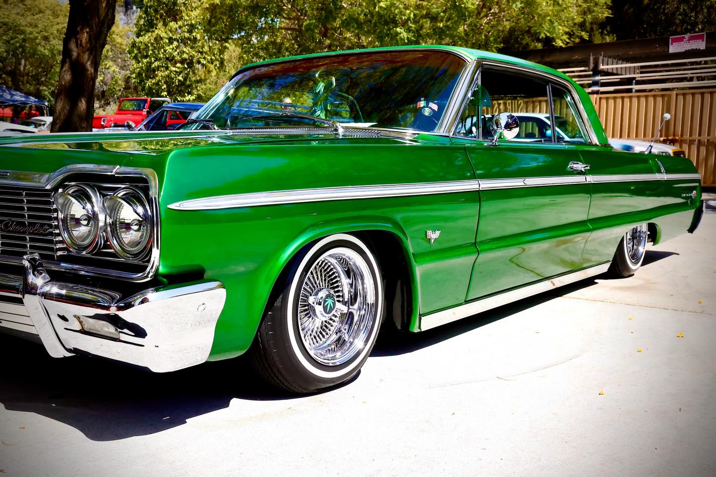 A candy-green classic lowrider at a San Diego car gathering.